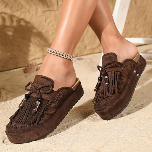 Mules tipo slide con lazo y flecos