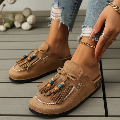 Mules tipo slide con lazo y flecos