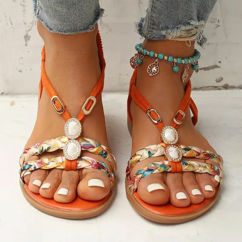 Sandalias planas con tiras trenzadas y adornos de gemas